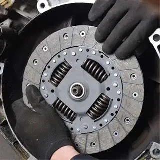 Man fixing car clutch